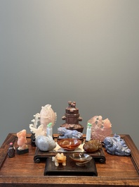 A group of Chinese carvings of lapis lazuli, pink quartz and other precious stones, with several stands, 19/20th C.