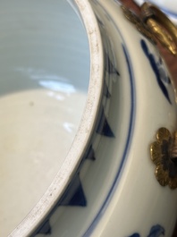 A Chinese blue and white covered bowl with floral design and gilt bronze mounts, Transitional period