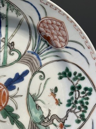Three Chinese famille verte plates and a teapot, Kangxi