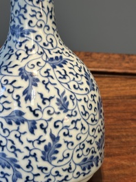 A Chinese blue and white 'lotus scroll' bottle vase, Yongzheng mark and possibly of the period