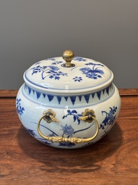 A Chinese blue and white covered bowl with floral design and gilt bronze mounts, Transitional period