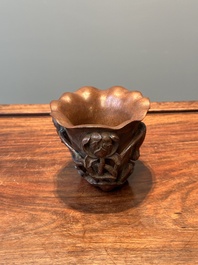 A Chinese carved bamboo 'lotus' libation cup, 17/18th C.