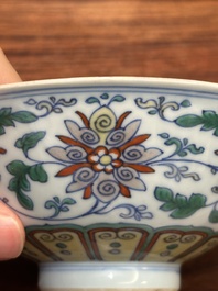 A Chinese doucai 'lotus scroll' bowl, Qianlong mark and of the period