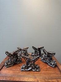 Five Chinese carved mother-of-pearl shells on wooden stands, Canton, 19th C.