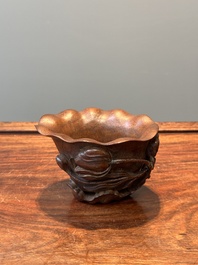 A Chinese carved bamboo 'lotus' libation cup, 17/18th C.