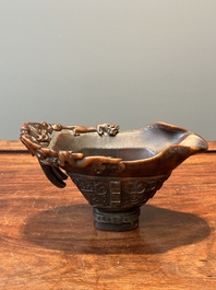 A Chinese carved rhinoceros horn 'libation cup' with chilong design, 17/18th C.