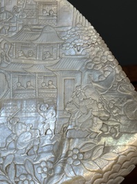 Five Chinese carved mother-of-pearl shells on wooden stands, Canton, 19th C.