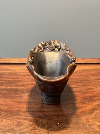 A Chinese carved rhinoceros horn 'libation cup' with chilong design, 17/18th C.