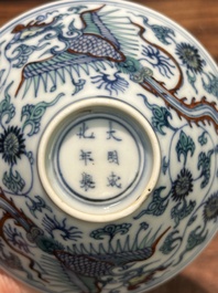 A Chinese doucai conical 'phoenixes' bowl, Chenghua mark, Kangxi/Yongzheng