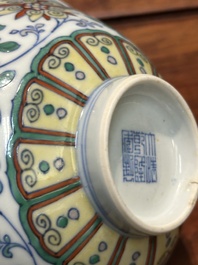 A Chinese doucai 'lotus scroll' bowl, Qianlong mark and of the period