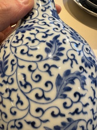 A Chinese blue and white 'lotus scroll' bottle vase, Yongzheng mark and possibly of the period