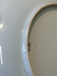 A Chinese famille verte caf&eacute;-au-lait ground plate and a monochrome white plate, Kangxi