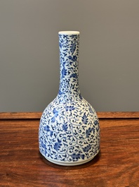 A Chinese blue and white 'lotus scroll' bottle vase, Yongzheng mark and possibly of the period