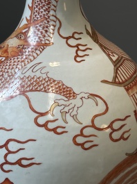 A Chinese iron-red-decorated and gilt 'dragon and carp' bottle vase, 19/20th C.