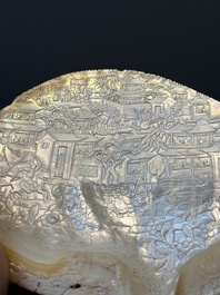 Five Chinese carved mother-of-pearl shells on wooden stands, Canton, 19th C.