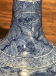 An exceptional Chinese blue and white 'mythic animals' garlic-mouth bottle vase on wooden stand, Kangxi mark and of the period