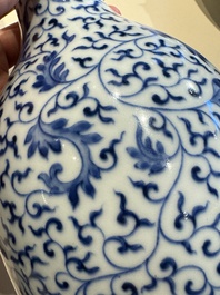 A Chinese blue and white 'lotus scroll' bottle vase, Yongzheng mark and possibly of the period