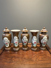 A Chinese capucin-brown-ground famille rose garniture of five vases with floral design, Yongzheng/Qianlong