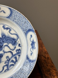 A pair of Chinese blue and white 'Buddhist lion' plates, ding mark, Kangxi