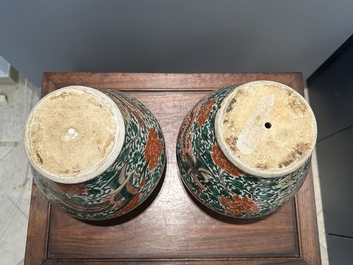 A pair of Chinese wucai 'phoenix and peony scroll' vases, Transitional period