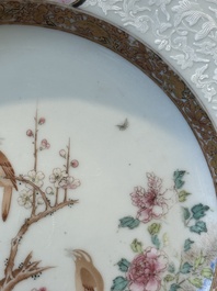 A pair of Chinese famille rose 'magpie and peony' plates with bianco-sopra-bianco rims, Yongzheng