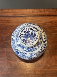 A pair of Chinese blue and white covered vases and three jars, 19th C.