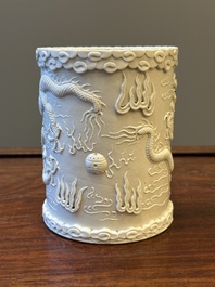 A Chinese monochrome white-glazed biscuit brush pot, signed Wang Bingrong 王炳榮, 19/20th C.