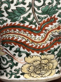 A pair of Chinese wucai 'phoenix and peony scroll' vases, Transitional period