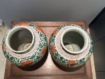 A pair of Chinese wucai 'phoenix and peony scroll' vases, Transitional period