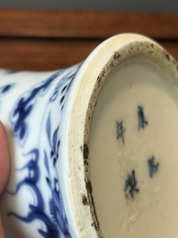 A pair of Chinese blue and white covered vases and three jars, 19th C.