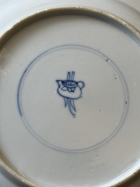 A pair of Chinese blue and white 'Buddhist lion' plates, ding mark, Kangxi