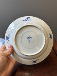 A pair of Chinese blue and white 'Buddhist lion' plates, ding mark, Kangxi