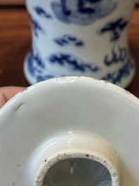 A pair of Chinese blue and white covered vases and three jars, 19th C.