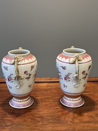 A pair of Chinese famille rose 'cornucopia' vases with chilong handles, Qianlong