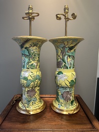 A pair of Chinese verte biscuit 'gu' vases with gilt bronze lamp mounts, 19th C.