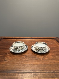 A pair of Chinese grisaille and gilt 'pheasant' cups and saucers, Yongzheng
