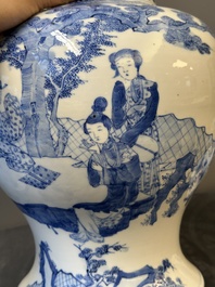 A pair of Chinese blue and white covered vases with figural design, 19th C.