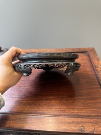A Chinese blue and white 'lotus scroll' jar with wooden cover and stand, Kangxi