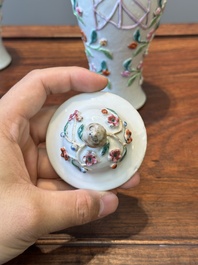 A pair of Chinese famille rose covered vases and a plate with applied floral design, Yongzheng