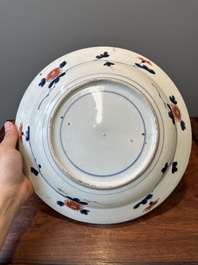 A Japanese Imari dish with carps among waves and clouds, Edo, 17th C.