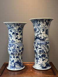 Two Chinese blue and white 'gu' vases with squirrels among grape vines, Kangxi