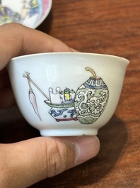 A Chinese famille rose cup and saucer with a court lady and a boy, Yongzheng