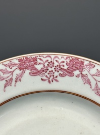 A pair of monogrammed Chinese puce-enamelled plates and a pair of armorial cups and saucers, Yongzheng/Qianlong