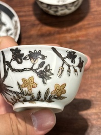 A pair of Chinese grisaille and gilt 'pheasant' cups and saucers, Yongzheng