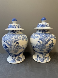 A pair of Chinese blue and white covered vases with figural design, 19th C.