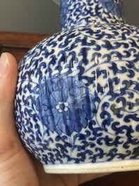 A pair of Chinese blue and white 'lotus scroll' kendis, 19th C.