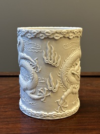 A Chinese monochrome white-glazed biscuit brush pot, signed Wang Bingrong 王炳榮, 19/20th C.