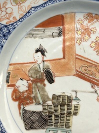 A pair of Chinese Imari-style plates with a merchant, lady and boy, Yongzheng