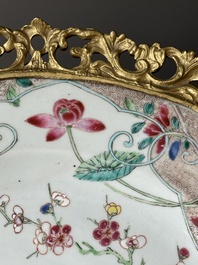 A Chinese famille rose 'flower basket' dish with gilt bronze mount, Yongzheng