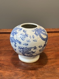 A pair of Chinese blue and white covered vases and three jars, 19th C.